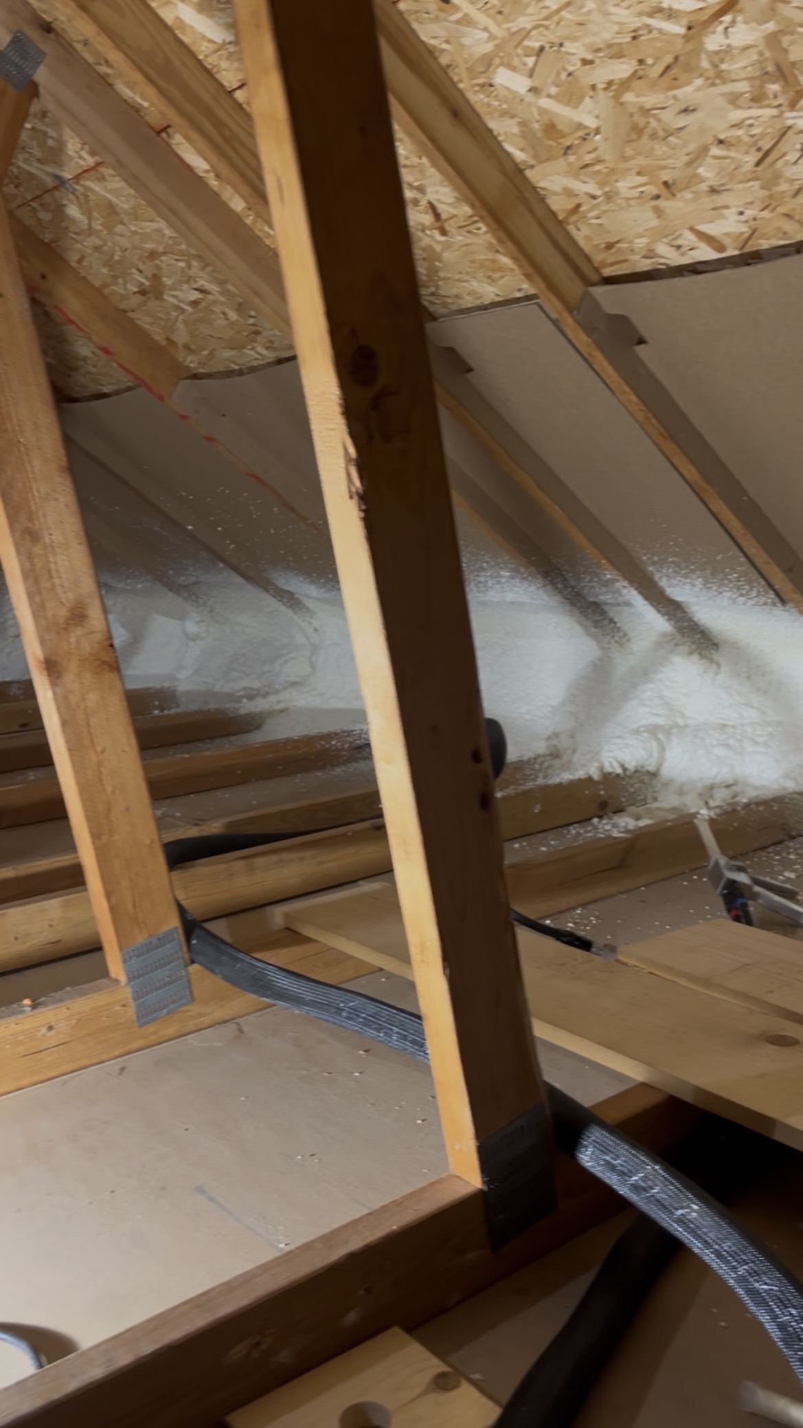 Spray foam insulation at attic eaves