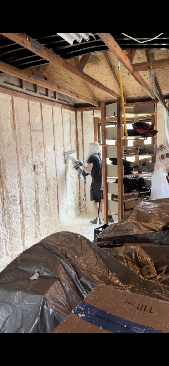 Spray foam wall installation in progress